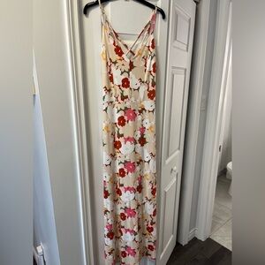 Floral maxi dress, soft stretch fabric, cross straps on back. Unworn with tags.